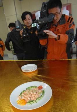 Reporters Shooting the Food Cooked by Robot
